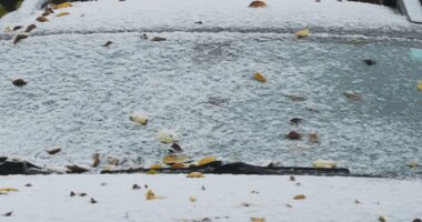 A car is covered with snow during a cold day in Evanston, Ill., Sunday, Nov. 9, 2025. (AP Photo/Nam Y. Huh)