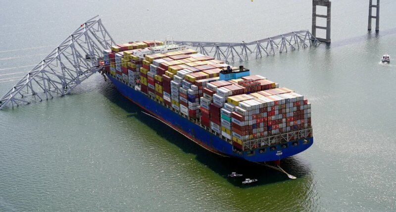 FILE - In this photo provided by the Maryland National Guard, the cargo ship Dali is stuck under part of the structure of the Francis Scott Key Bridge after the ship hit the bridge March 26, 2024, in Baltimore. (Maryland National Guard via AP, File)