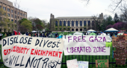 FILE - Signs are displayed outside a tent encampment at Northwestern University on April 26, 2024, in Evanston, Illinois. (AP Photo/Teresa Crawford, file)