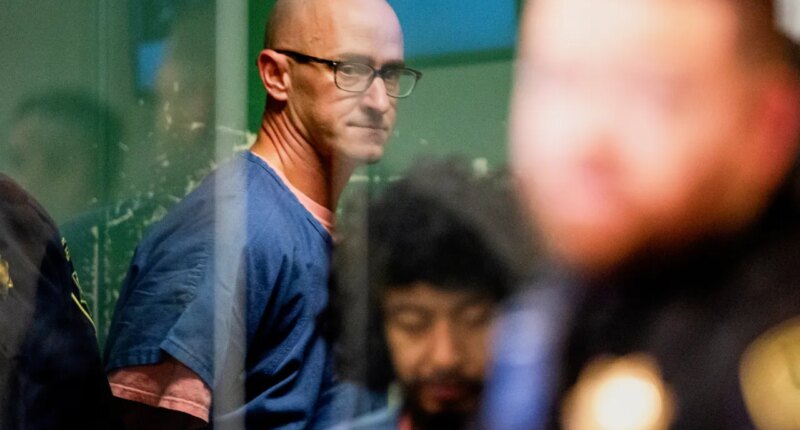 FILE - Joseph David Emerson, back, appears in Multnomah County Circuit Court for an indictment hearing in Portland, Ore., on Dec. 7, 2023. (Dave Killen/The Oregonian via AP, Pool, File)