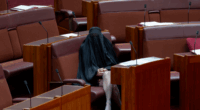 Senator Pauline Hanson wears a burqa in the Senate at Parliament House in Canberra on November 24, 2025. fedpol Photo: Dominic Lorrimer
