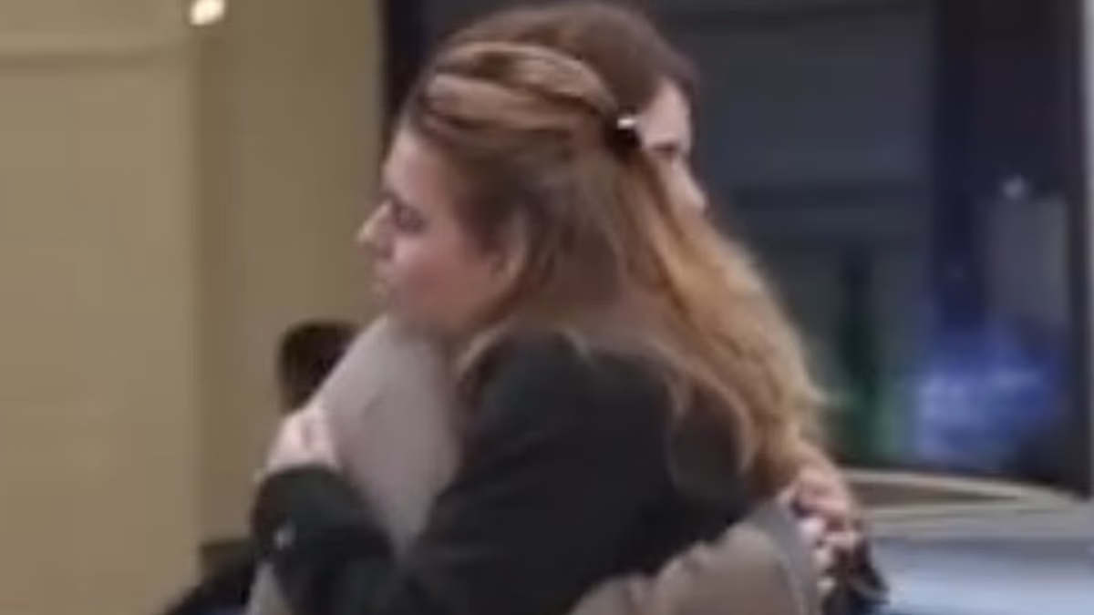 Princesses Beatrice and Eugenie share an emotional hug