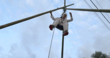 Pro-Palestine activist suspended from giant tripod in Brisbane