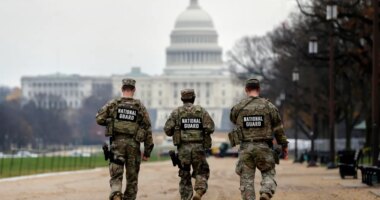 National Guard patrol along the National Mall in front of the Capitol, Wednesday, Nov. 26, 2025, in Washington. (AP Photo/Rahmat Gul)