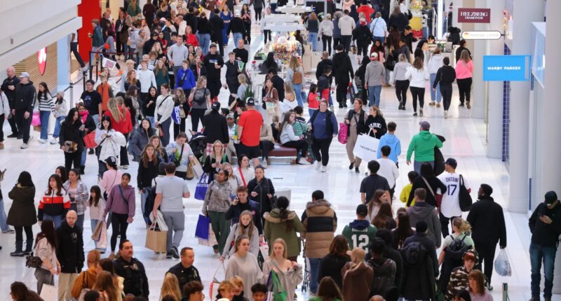 Shoppers browse through stores at Mall of America for Black Friday deals, Friday, Nov. 28, 2025, in Bloomington, Minn. (AP Photo/Adam Bettcher)