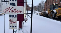 A snowplow operates outside a church in Lowville, N.Y., on Friday, Nov. 28, 2025. (AP Photo/Cara Anna)