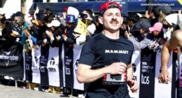Lukas Schindler from Switzerland crossing the finish line at the Sydney marathon.