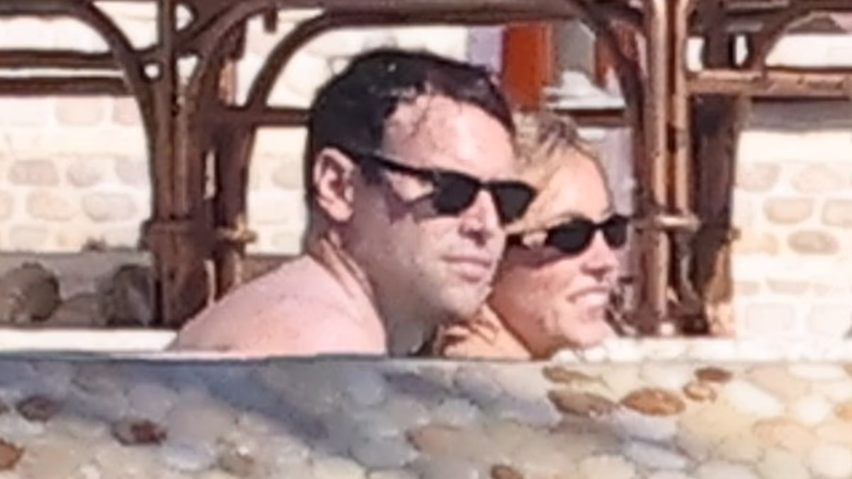 Sydney Sweeney wears swimsuit as she snuggles up to Scooter Braun