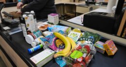 A cashier scans groceries, including produce, which is covered by the USDA Supplemental Nutrition Assistance Program (SNAP), at a grocery store in Baltimore, Monday, Nov. 10, 2025. (AP Photo/Stephanie Scarbrough)