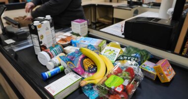 A cashier scans groceries, including produce, which is covered by the USDA Supplemental Nutrition Assistance Program (SNAP), at a grocery store in Baltimore, Monday, Nov. 10, 2025. (AP Photo/Stephanie Scarbrough)