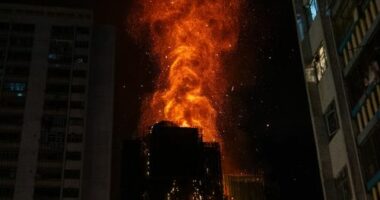 Thirteen dead, more still trapped as apartment buildings burn