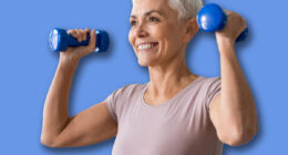 Active European senior lady with stylish haircut stays fit exercising with dumbbells, lifting weight flexing arms muscles, standing at home indoor. Domestic workout concept