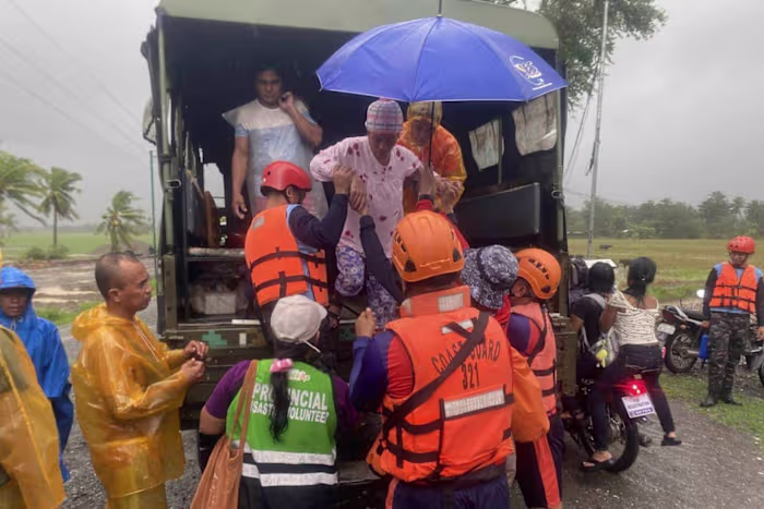 Typhoon Fung-wong blows away from the Philippines, leaving 2 dead and 1.4 million displaced
