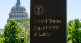 FILE - In this May 7, 2020, file photo, the entrance to the Labor Department is seen near the Capitol in Washington. (AP Photo/J. Scott Applewhite, File)