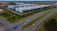 FILE - Cars drive past data centers that house computer servers and hardware required to support modern internet use, such as artificial intelligence, in Ashburn, Virginia, July 16, 2023. (AP Photo/Ted Shaffrey, File)