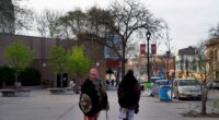 FILE - Women walk down a street in the predominantly Somali neighborhood of Cedar-Riverside in Minneapolis on May 12, 2022. (AP Photo/Jessie Wardarski, File)