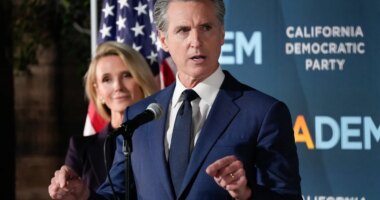 California Gov. Gavin Newsom speaks as he stands with first partner Jennifer Siebel Newsom during an election night press conference at a California Democratic Party office Tuesday, Nov. 4, 2025, in Sacramento, Calif. (AP Photo/Godofredo A. Vásquez)
