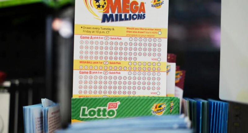 FILE - Mega Millions Lottery play slips are displayed for customers at a convenience store in Chicago, Sunday, April 6, 2025. (AP Photo/Nam Y. Huh, file)