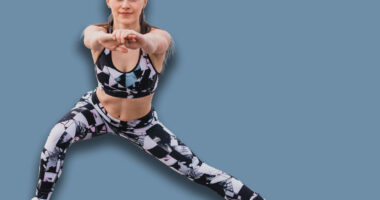 Woman doing walking lunges outdoors overlooking the river. Fitness, sport and healthy lifestyle concept.