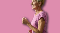 Portrait of a senior elderly woman exercising in a gym, running using threadmill machine equipment, healthy lifestyle and cardio exercise at fitness club concepts, vitality and active senior