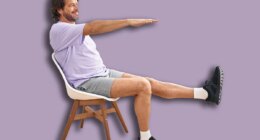 Middle age man smiling confident sitting on chair stretching at sport center