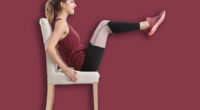 Young woman exercising with chair indoors. Home fitness