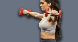 A sporty muscular sportspeople is doing lateral raise on a bunch in a gym.