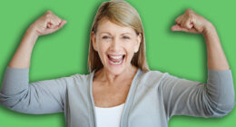 Flexing, portrait and smile with mature woman in studio on gray background for achievement or victory. Arms, bicep and winner with strong person showing muscles for health goal, motivation or success