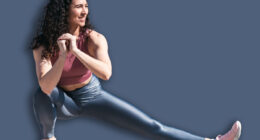 Young smiling fit woman doing stretching exercises for legs before training. Female athlete preparing for jogging outdoors. Runner doing side lunges. Active lifestyle concept.