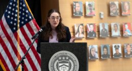 FILE - Survivor of gun violence Mia Tretta speaks while standing next to a wall with photographs of victims of gun violence during the Inaugural Gun Violence Survivors