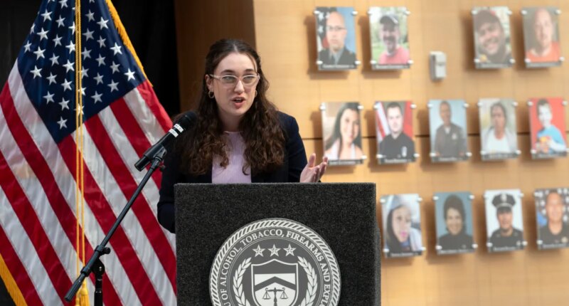 FILE - Survivor of gun violence Mia Tretta speaks while standing next to a wall with photographs of victims of gun violence during the Inaugural Gun Violence Survivors