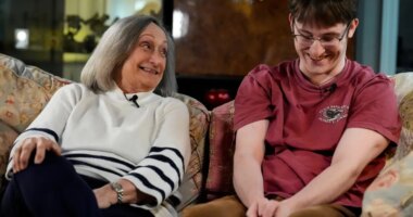 Donna West sits with her grandson Paul Quirk as they speak to a reporter, Tuesday, Dec. 2, 2025, in Marietta, Ga. (AP Photo/Mike Stewart)