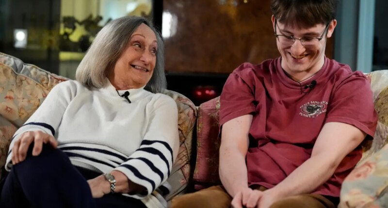 Donna West sits with her grandson Paul Quirk as they speak to a reporter, Tuesday, Dec. 2, 2025, in Marietta, Ga. (AP Photo/Mike Stewart)