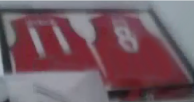 Red football jerseys framed for posterity.