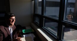 Juan Espinoza, vice provost for enrollment management at Virginia Tech, poses for a photo in his office, Nov. 12, 2025, in Blacksburg, Va. (AP Photo/Shaban Athuman)