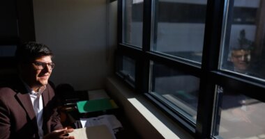 Juan Espinoza, vice provost for enrollment management at Virginia Tech, poses for a photo in his office, Nov. 12, 2025, in Blacksburg, Va. (AP Photo/Shaban Athuman)