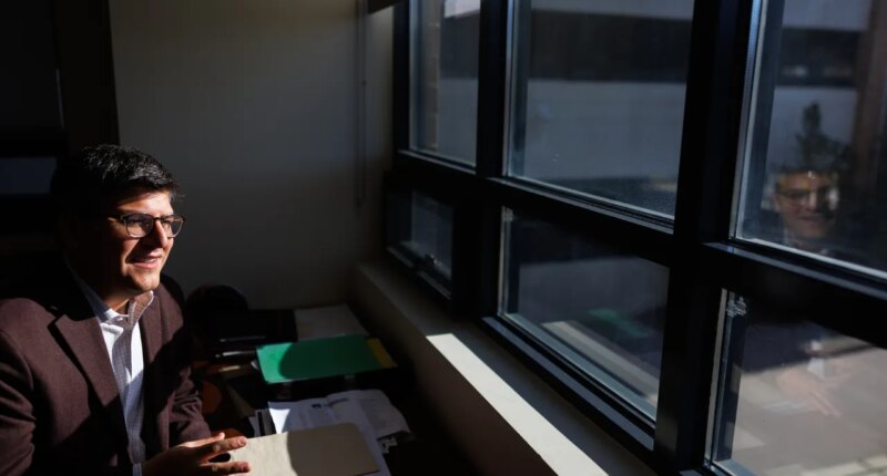 Juan Espinoza, vice provost for enrollment management at Virginia Tech, poses for a photo in his office, Nov. 12, 2025, in Blacksburg, Va. (AP Photo/Shaban Athuman)