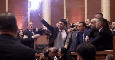 Albanian opposition lawmakers light flares, scuffle with police amid parliament chaos over corruption probe