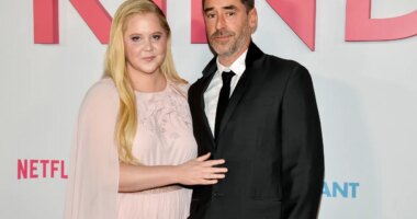 FILE - Amy Schumer and husband Chris Fischer attend the premiere of Netflix