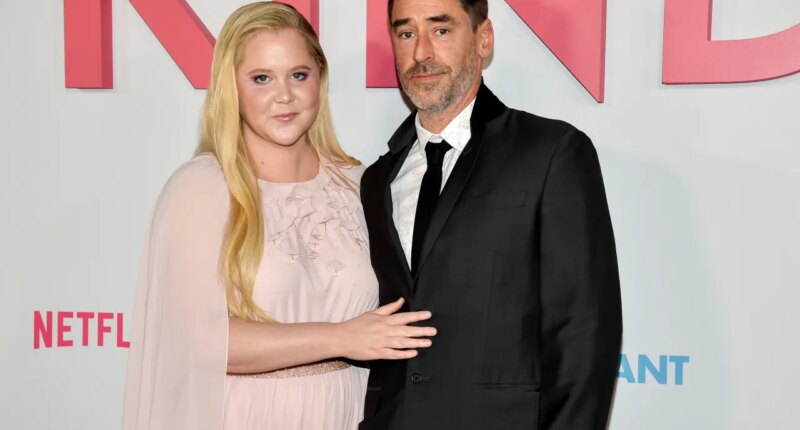 FILE - Amy Schumer and husband Chris Fischer attend the premiere of Netflix