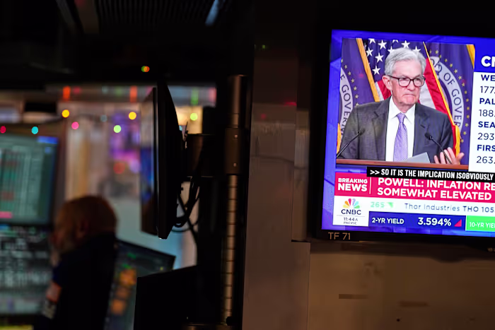 Asian shares are mixed after Fed cuts rates, pushing Wall Street near its record