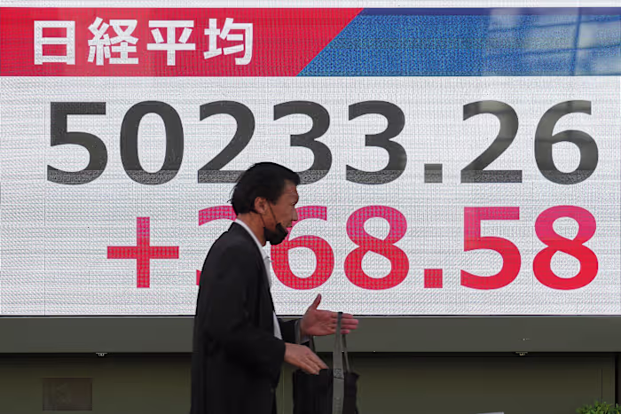 Asian shares are mixed after Wall Street pulls near its all-time high