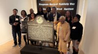 Descendants of Mary Turner, who was lynched in 1918, pose with her historic marker and artist Lonnie Holley, fourth from left, at the National Center for Civil and Human Rights, on Dec. 6, 2025 in Atlanta. (AP Photo/Michael Warren)