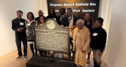 Descendants of Mary Turner, who was lynched in 1918, pose with her historic marker and artist Lonnie Holley, fourth from left, at the National Center for Civil and Human Rights, on Dec. 6, 2025 in Atlanta. (AP Photo/Michael Warren)