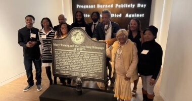 Descendants of Mary Turner, who was lynched in 1918, pose with her historic marker and artist Lonnie Holley, fourth from left, at the National Center for Civil and Human Rights, on Dec. 6, 2025 in Atlanta. (AP Photo/Michael Warren)