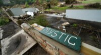 FILE - A Camp Mystic sign is seen near the entrance to the establishment along the banks of the Guadalupe River in Hunt, Texas, July 5, 2025, after a flash flood swept through the area. (AP Photo/Julio Cortez, File)