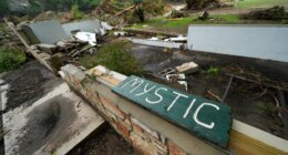 FILE - A Camp Mystic sign is seen near the entrance to the establishment along the banks of the Guadalupe River in Hunt, Texas, July 5, 2025, after a flash flood swept through the area. (AP Photo/Julio Cortez, File)