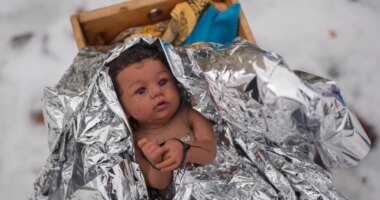 A doll representing the baby Jesus is zip-tied in the Nativity scene outside of Lake Street Church of Evanston, Wednesday, Dec. 10, 2025, in Evanston, Ill. (AP Photo/Erin Hooley)