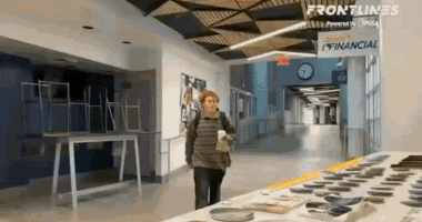 gif student swipes TPUSA table steals signs