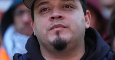 Kilmar Abrego Garcia listens during a rally ahead of a mandatory check at the Immigration and Customs Enforcement office in Baltimore, Friday, Dec. 12, 2025, after he was released from detention on Thursday under a judge